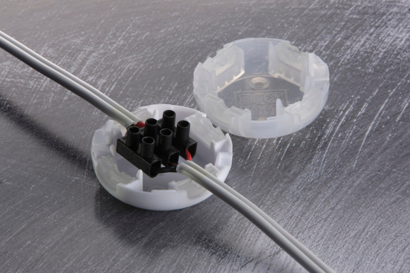 RIPBOX junction box halves clipping together over a connection